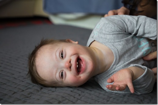 Portrait of cute baby boy with Down syndrome